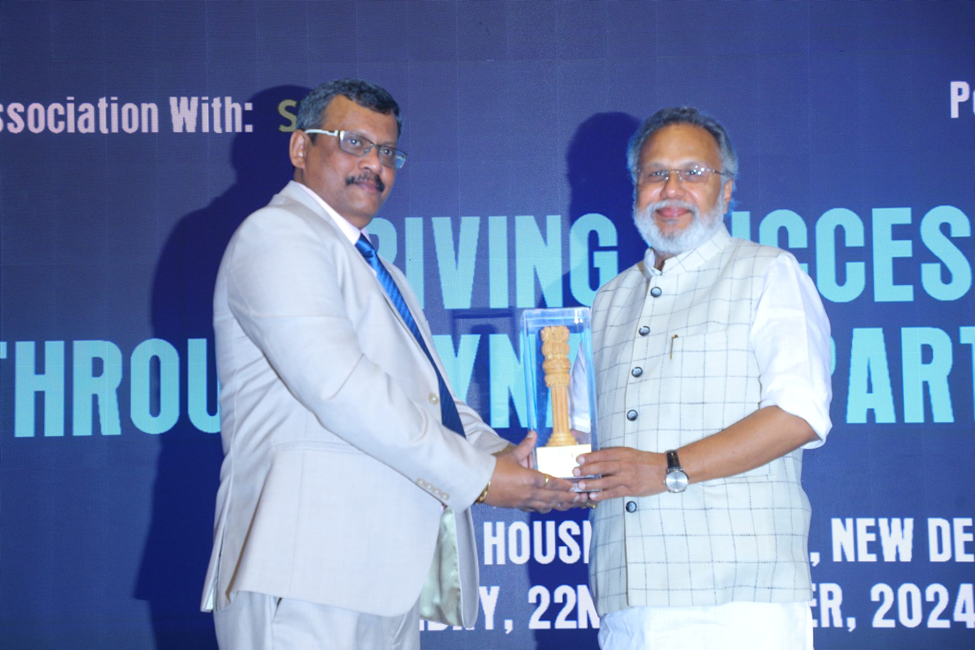 Mr. Sunil J Singhi receiving the  token of Appreciation